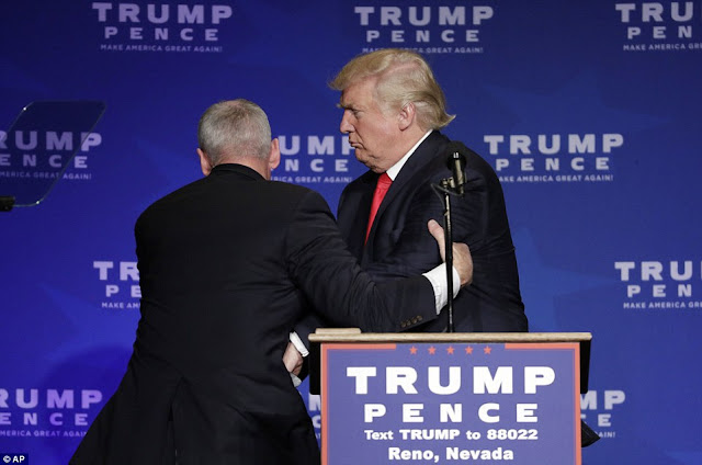 donald trump dragged off stage secret agent