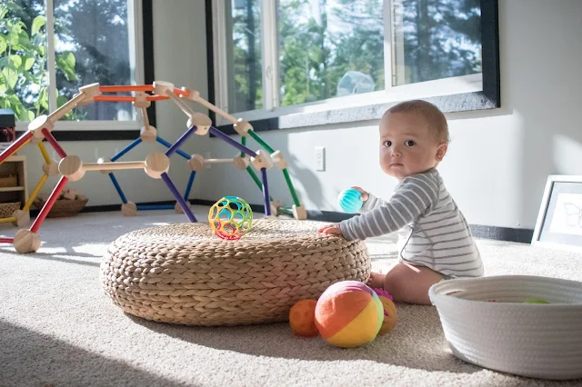 A treasure basket of balls is the perfect way to encourage and support movement in Montessori babies. 