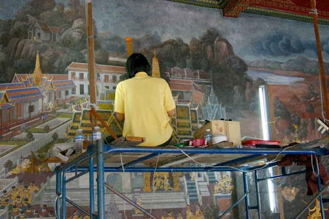 Restorations of wall murals by trained artists.