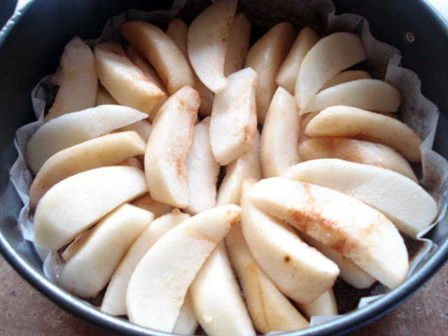 Place the quartered pears on top of the butter-sugar mixture