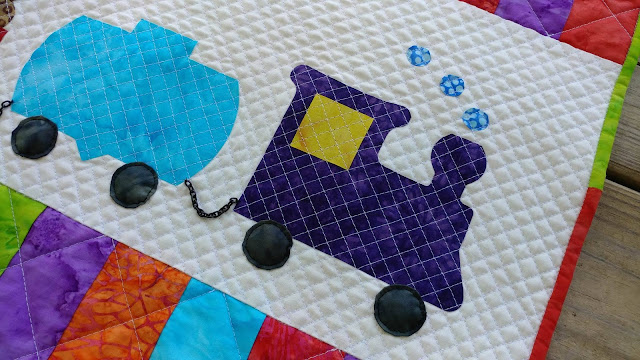 Row by Row On the Go zoo animals and train baby quilt