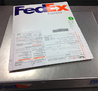 Flying Dogs To Italy : Our FedEx package heading to Austin to gain our dogs' clearance for travel to Italy