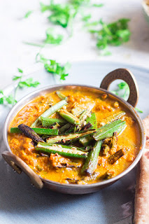 Pan fried okra cooked in a curry made with pickle spices and yogurt.