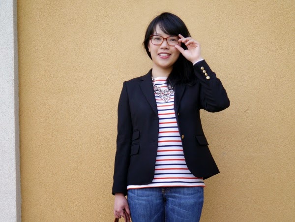 An outfit composed of basics: stripes, denim, black blazer, and some sparkle