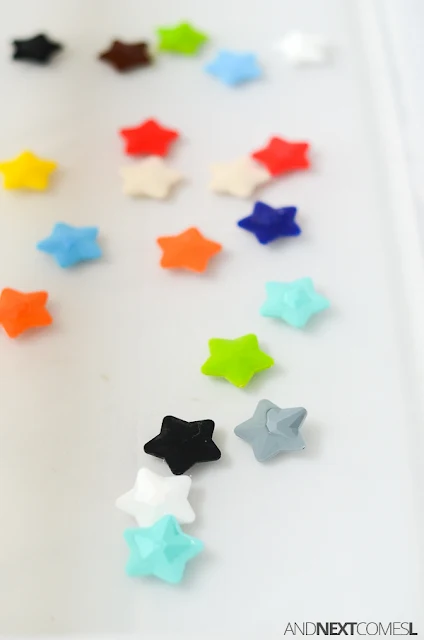Star themed water sensory bin for kids from And Next Comes L