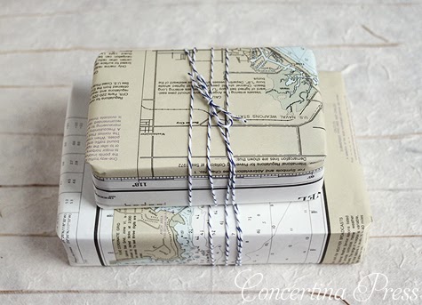 presents wrapped in nautical charts with striped twine bows from Concertina Press