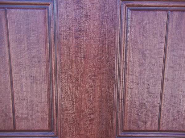 detail of garage door painted to look like wood