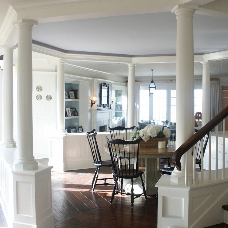 Charming traditional coastal decor in dining room of Malibu beach house by Giannetti Home