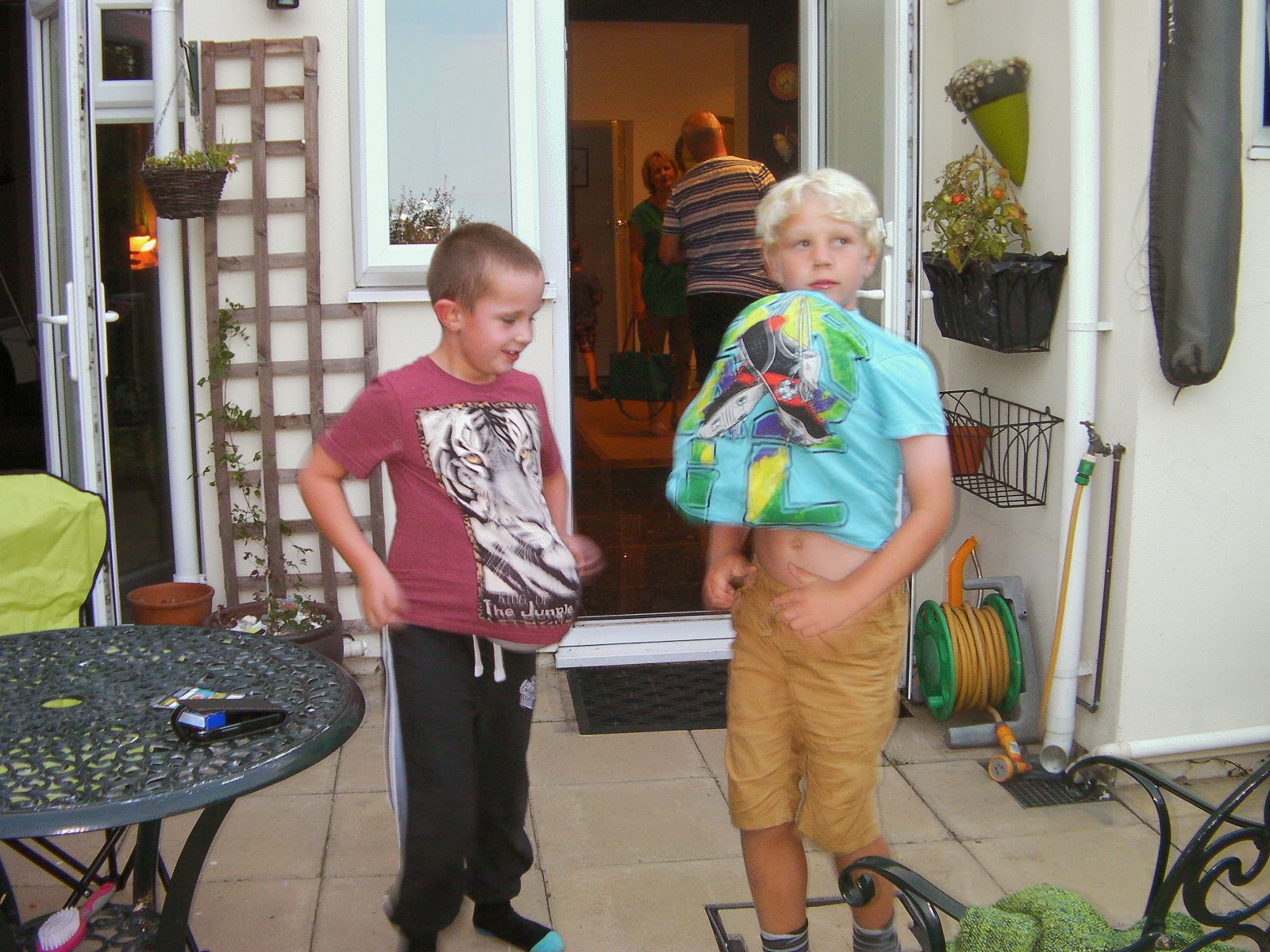 boys with balloons stuffed up their shirts birthday party silliness balloons in shirts