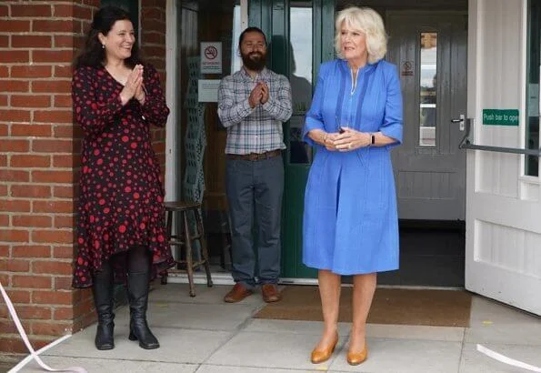 Duchess of Cornwall, Patron of Community First, visited Oxenwood Outdoor Education Centre. She wore a blue summer dress and pearl earrings