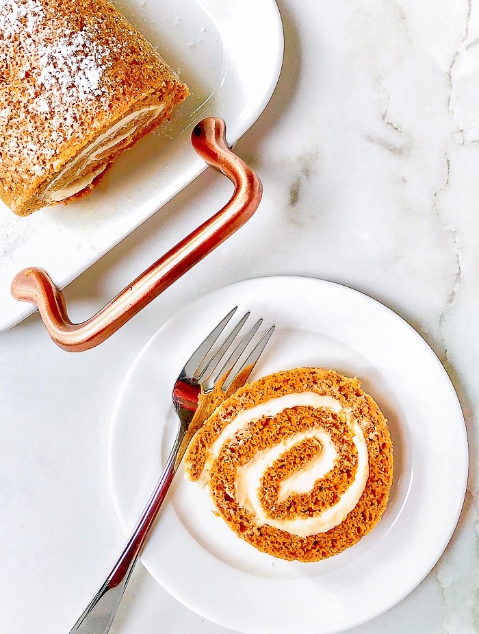 This spiced Maple Pumpkin Roll Cake with a delectable cream cheese