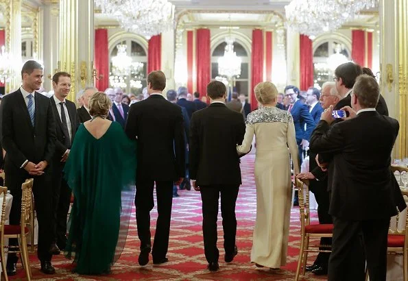 Brigitte Macron wore Louis Vuitton pumps, Duchess Maria Terasa wore Fendi fur coat and Miu Miu shoes for state dinner at Elysee Palace in Paris