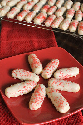 Rum Logs are the perfect addition to any Christmas Cookie Platter.  They're light, slightly sweet, soft and will melt in your mouth! #ChristmasCookies
