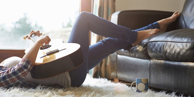 Living Alone Woman Playing Guitar