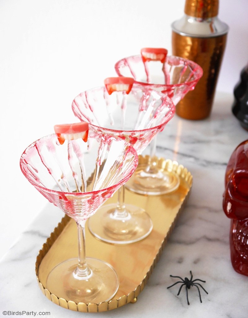 DIY Bloody Halloween Cocktail Glasses  - learn to create this edible blood effect to decorate your cocktail glasses and make them all creepy and spooky! by BirdsParty.com @birdsparty