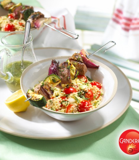 Lemon and mint lamb kebabs with couscous salad in a bowl
