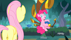 Fluttershy finds Pinkie Pie with a large 5 piped bagpipe contraption in the forest.