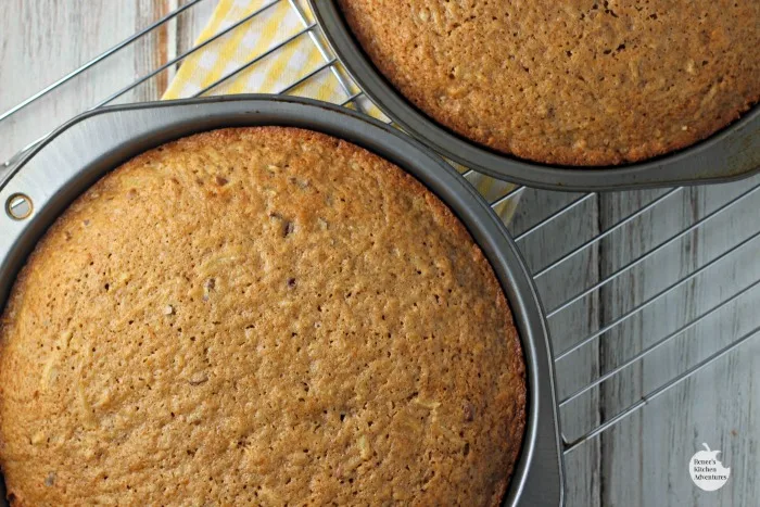 Baked cakes cooling in pans on wire rack