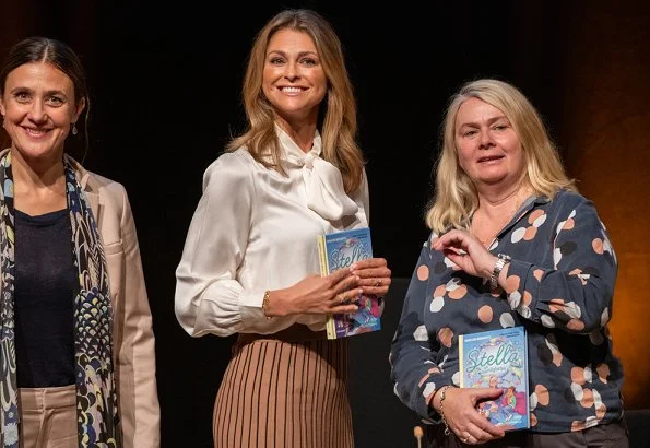 Princess Madeleine wore Dagmar Sabina pleated midi skirt. Princess at the launch of her book Stella and the Secret