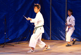 Children doing karate with weapons