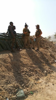   U.S. SF servicemen talking with their Cameroonian counterpart.