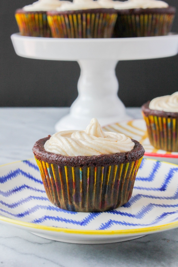 These are by far some of the best chocolate cupcakes I've ever eaten! The cupcakes are so moist and tender and the frosting is rich and creamy. These decadent treats are flourless and have a secret ingredient that no one will ever believe!