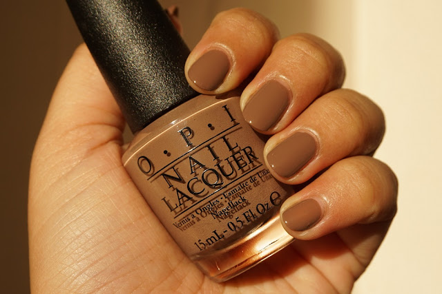 OPI Over The Taupe Swatch under warm afternoon Sunlight