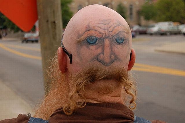 6. Head Tattoo Ideas for Men: Tribal, Skulls, and More - wide 5