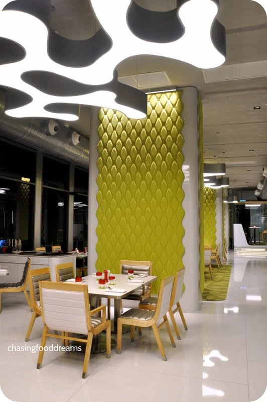 A futuristic restaurant setting with interactive displays and personalized dining options.
