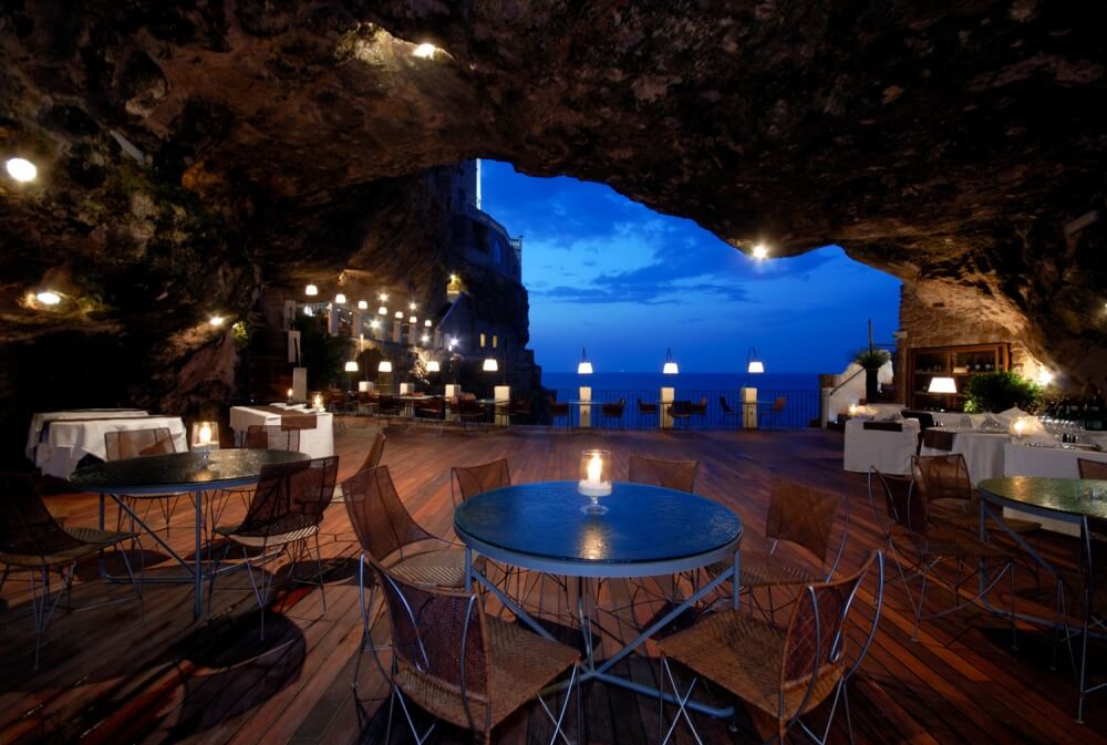 22 Stunning Hotels That Will Make You Want to Book Your Next Trip NOW! - Hotel Ristorante Grotta Palazzese Polignano a Mare, Italy