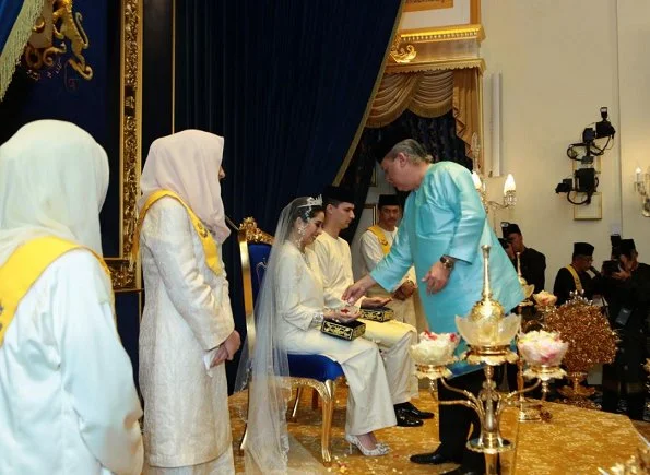 Dutchman Dennis Muhammad and Johor Princess Tunku Tun Aminah Maimunah Iskandariah Sultan Ibrahim, after wedding ceremony at the Istana Besar