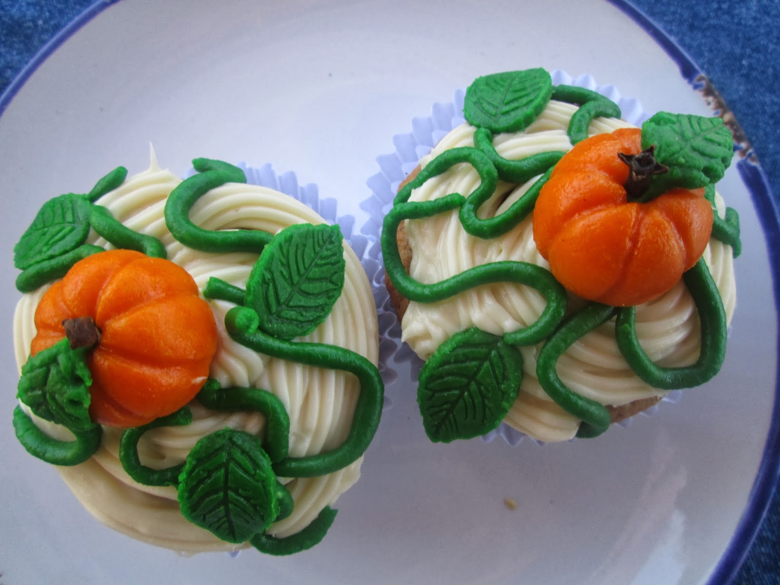 Canela kitchen (gloria) pumpkin cupcakes (garnish by my daughter