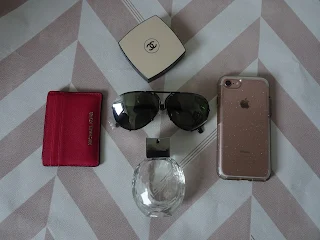 flat lay chanel compact with porche sunglasses 