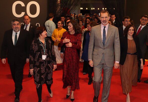 Queen Letizia wore a new printed satin dress by Maje. Prada leather pumps