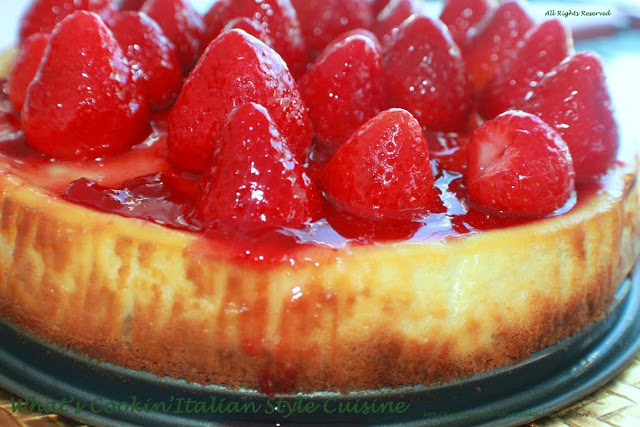 Strawberry cheesecake a copycat from Utica New York wiith whole strawberries and glazed 