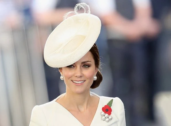 Kate Middleton wore Alexander McQueen cream coatdress. Anne Grand-Clement clutch, Balenciaga pearl earrings. Mathilde Natan lace dress