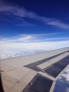 vacation to go fly on a plane in the clouds
