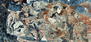 Spain fields from the air,abstract photograph surrealism,Abstract Naturalism,abstract expressionism Spain fields from the air which mimic an abstract painting,artistic representation of human labor camps bird's eye view ,