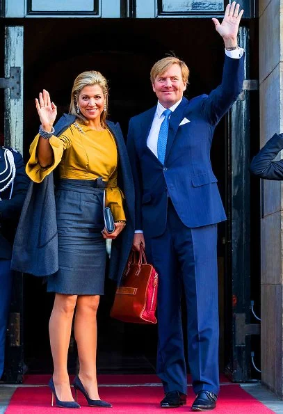 Princess Beatrix and Princess Margriet. Queen Maxima wore Natan top and skirt, Gianvito Rossi suede pumps, Travelteq work bag