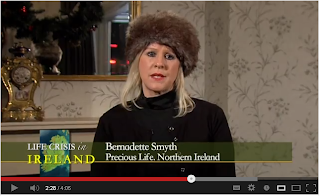 Bernadette Smyth of Precious Life, wearing a ridiculous fur hat indoors.
