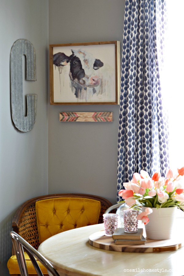 Spring farmhouse decor in the kitchen. Mixing everyday gray and navy with a splash of pink!