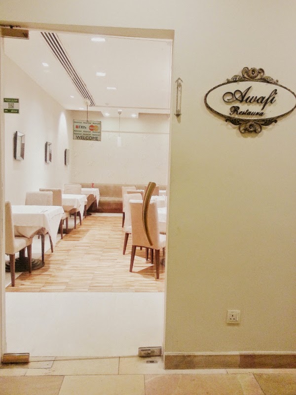 Blankets and Coffee pawprints around a tiny island. A food & coffee