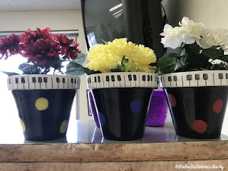 Be inspired by this farmhouse themed music room.  Rustic decor and bold accents help set this music classroom up for optimal learning.  Bulletin boards, flexible seating, organization ideas and more!