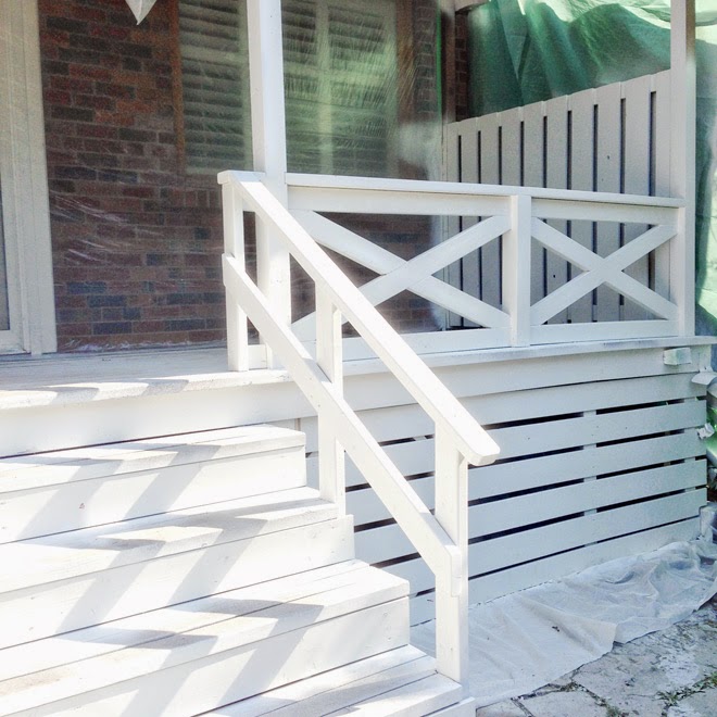 back deck covered porch white x cross railing