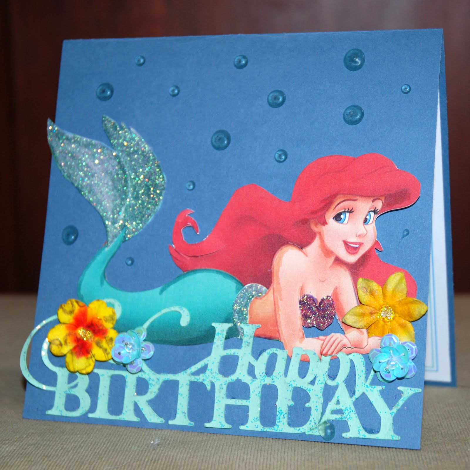 For this card, I fussy-cut an image of Ariel from a special Disney paper. 