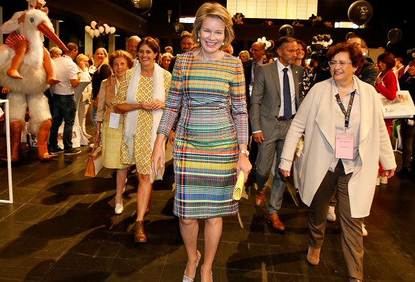 Queen Mathilde wore a plaid madras sheath dress by Dries Van Noten. The National Board of Child Welfare (Oeuvre Nationale de l'Enfance)