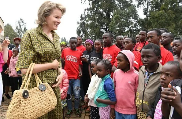 Queen Mathilde Dries Van Noten jacket and trousers, Natan dress, Crown Princess Elizabeth in Maje blouse and white trousers