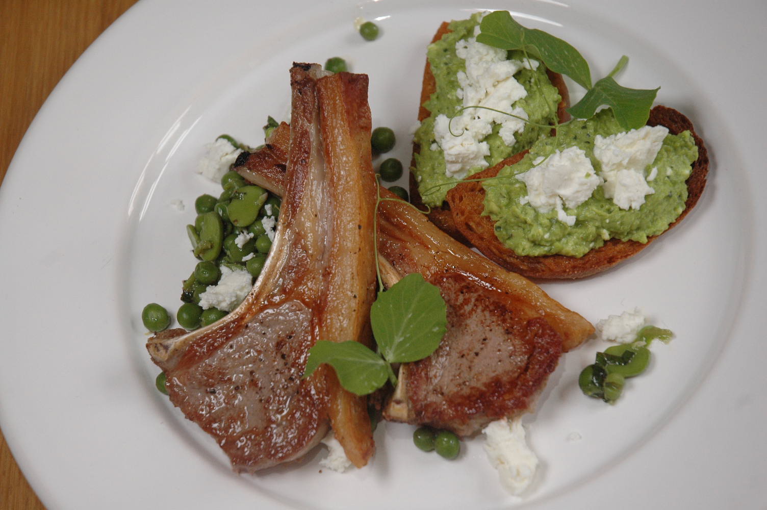 nueva cocina Salt marsh lamb, broad beans, feta, crostini, peas & shoots