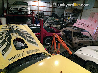 A large hood bird frames the shaker hole in the raised yellow Trans Am hood.