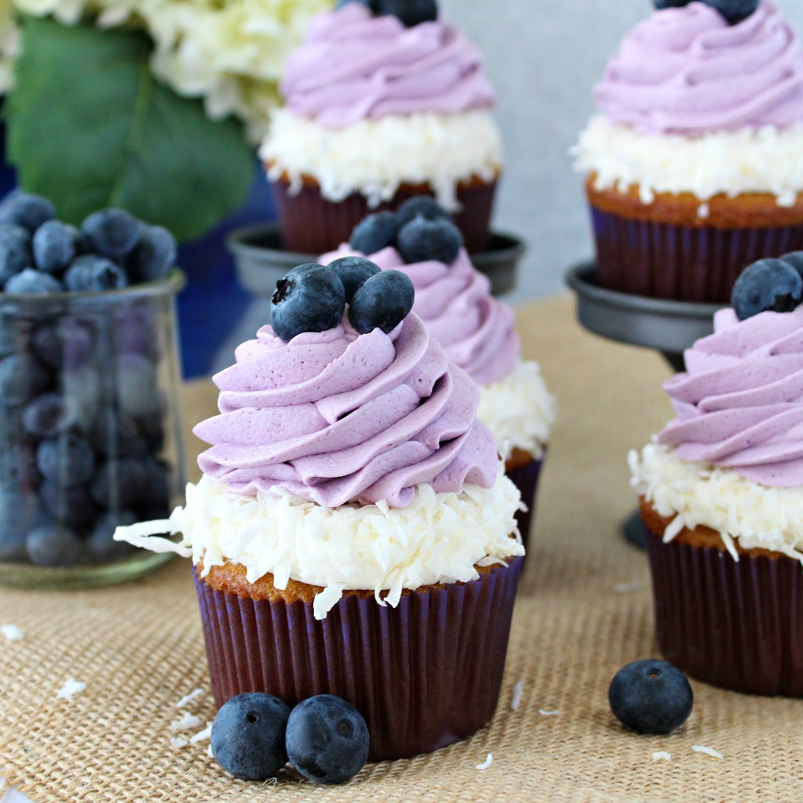 Coconut Cupcakes with Coconut and Blueberry Frosting.